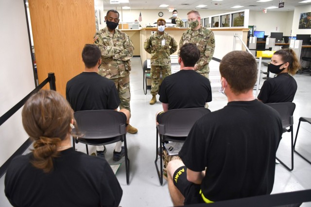 Maj. Gen. Jonathan Woodson, left, commanding general, Army Reserve Medical Command, talks to cadets while touring the Soldier Readiness Processing site for the 2021 Cadet Summer Training on Monday, July 12. Woodson was accompanied by CW5 John Horn jr., ARMEDCOM command chiref warrant officer, right. The SRP site is a part of the ARMEDCOM medical support offered annually to the Fort Knox, Ky. training exercise, and ensures cadets are medically safe to train in the exercise and ready for commissioning. CST is the largest annual training exercise executed by the U.S. Army, graduating almost 10,000 Cadets from Advanced Camp or Basic Camp each summer. More than 250 ARMEDCOM Soldiers have provided support to the exercise, including medics, physicians, x-ray technicians, pharmacy technicians and lab technicians.