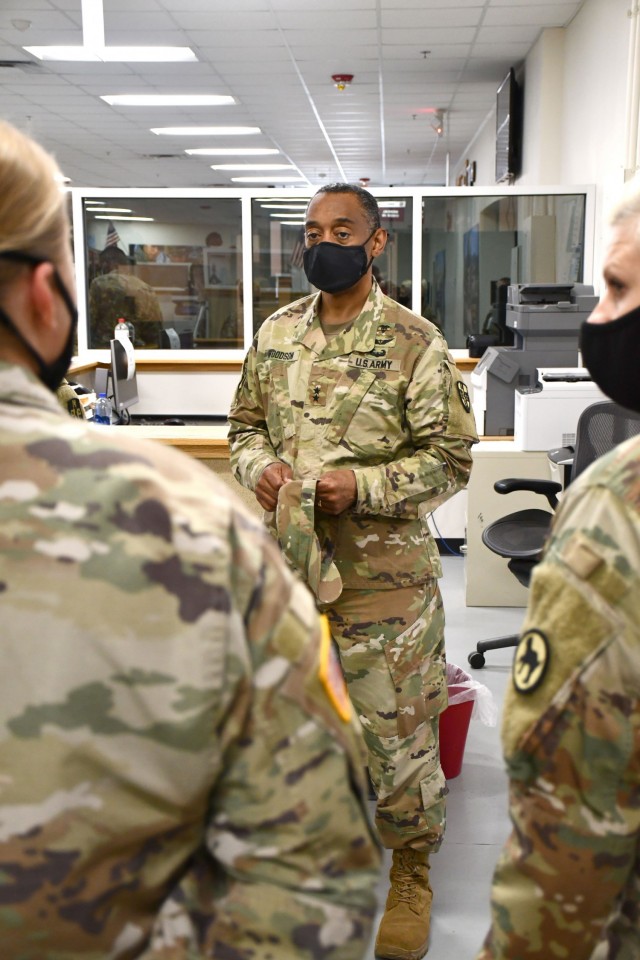 Maj. Gen. Jonathan Woodson, commanding general, Army Reserve Medical Command, speaks with ARMEDCOM Soldiers supporting the 2021 Cadet Summer Training while touring the Soldier Readiness Processing site on Monday, July 12. The SRP site is a part of the ARMEDCOM medical support offered annually to the Fort Knox, Ky. training exercise, and ensures cadets are medically safe to train in the exercise and ready for commissioning. The CST is the largest annual training exercise executed by the U.S. Army, graduating almost 10,000 Cadets from Advanced Camp or Basic Camp each summer. More than 250 ARMEDCOM Soldiers have provided support to the exercise, including medics, physicians, x-ray technicians, pharmacy technicians and lab technicians.
