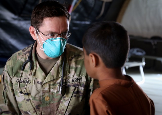U.S. Army Maj. Philip Goering, a family medicine physician, U.S. Army Health Clinic Wiesbaden, Landstuhl Regional Medical Center, evaluates an Afghan evacuee seeking medical assistance as part of medical operations in support of Operation Allies Refuge at Ramstein Air Base, Germany, Aug. 26. The medical operations are part of U.S. Armed Forces medical efforts in response to the Afghanistan evacuations at Ramstein Air Base, which has transformed itself into the logistical hub for the evacuation of people from Afghanistan.