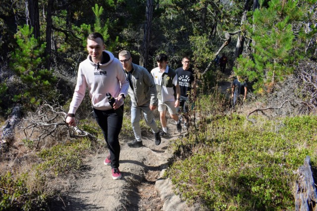 From front, Noah Sheppard, Iman Javanmardi, Sam Chase, Andres Ramirez and Brandon Munoz, military service members and students at the Defense Language Institute Foreign Language Center, hike during the Volksmarch at the Presidio of Monterey, Calif., Aug. 28.