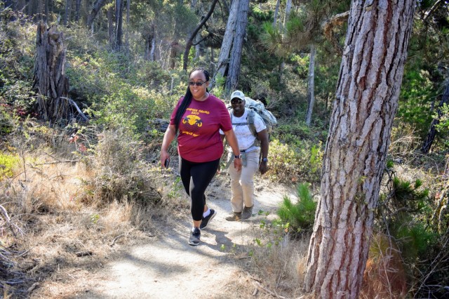 Maj. Kurt Reynolds, a student at the Navy Postgraduate School in Monterey, and his wife Ashley, hike during the Volksmarch at the Presidio of Monterey, Calif., Aug. 28.