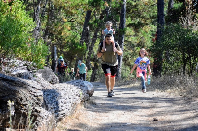 Families with children hike during the Volksmarch at the Presidio of Monterey, Calif., Aug. 28.