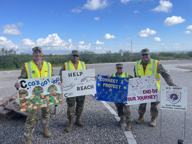 L-R – CPT David Moehling (C 305th), MAJ Jason Vaugh (Deputy Commander EPG), 1SG Marie Boyd (C 305th), and COL Rob Barnhill (Commander EPG) participated in Leaders at the Gate this morning.  Creative signs by ‘C Co’ 305th.