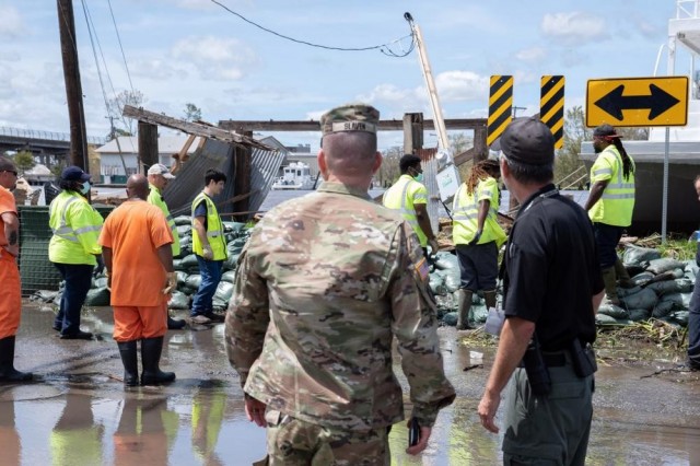 Col. James Slaven, assigned to the Louisiana National Guard, meets with St. Charles Parish emergency management officials in Hahnville, La., Aug. 30, 2021, during the recovery from Hurricane Ida. 