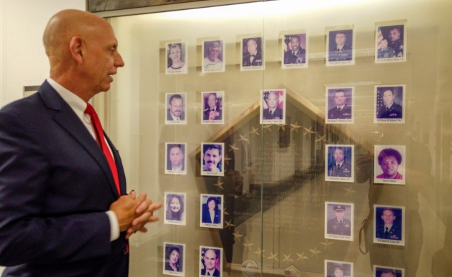 Franklin Childress, director of Army Reserve communications,  stands by a memorial he designed in the Pentagon, honoring the 29 people killed on 9/11 from the offices of the Assistant Secretary of the Army for Manpower and Reserve Affairs and the Deputy Chief of Staff for Personnel. 