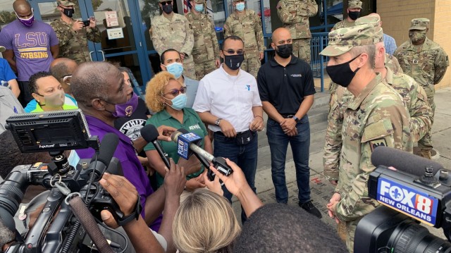 Army Gen. Daniel Hokanson, chief, National Guard Bureau, talks with community leaders during a visit to assess the Hurricane Ida response and thank troops in New Orleans, Louisiana, Sept. 7, 2021. This image was acquired using a cellular device. (U.S. Army National Guard photo by Master Sgt. Jim Greenhill)