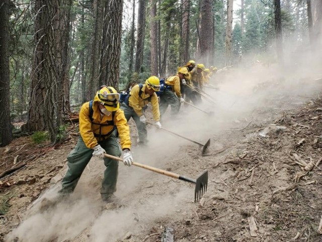 A handcrew from the California National Guard's Joint Task Force 578 fights the Dixie Fire as part of the mutual aid system in support of CAL FIRE, Aug. 16, 2021, in Northern California. (U.S. Army National Guard photo by 1st Sgt. Harley Ramirez)