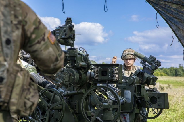 A Soldier with Archer Battery, Field Artillery Squadron, 2nd Calvary Regiment, waits to fire his squad's assigned M777A2 Howitzer during the Saber Junction 21 live-fire exercise Sept. 1, 2021, in Grafenwoehr Training Area, Germany. The U.S. Army Europe and Africa-directed exercise is designed to assess the readiness of units under 7th Army Training Command to conduct unified land operations in a joint, combined environment and to promote interoperability with participating Allies and partner nations. (U.S. Army photo by Spc. Nathaniel Gayle)