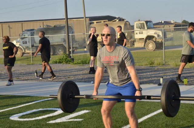 Second Lieutenant Chris Edwards, an unassigned Army Chaplain candidate from U.S. Army Chaplain Recruiting Team-North Central Illinois, completes a deadlift exercise during physical training Sept. 2 at the Bastogne physical training field. Edwards was among dozens of candidates attending the inaugural Army Chaplain Experience Day, which simulated a day in the life of a Soldier and provided valuable information about the chaplaincy.