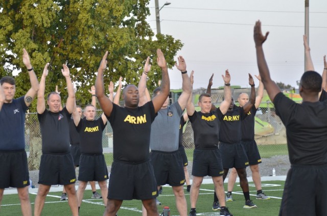 Army Chaplain candidates from across the U.S come together for a physical training session Sept. 2 at the Bastogne PT field, part of the inaugural Army Chaplain Experience Day.