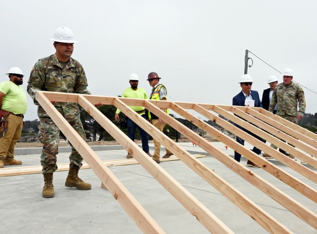 Col. Varman Chhoeung, left, commander of U.S. Army Garrison Presidio of Monterey, raises the first vertical wall of the Lower Stilwell housing development with Ted Lim of The Michaels Organization LLC, the Army’s commercial partners in developing and overseeing military housing on the Monterey Peninsula, at the Ord Military Community, Calif., Sept. 8.