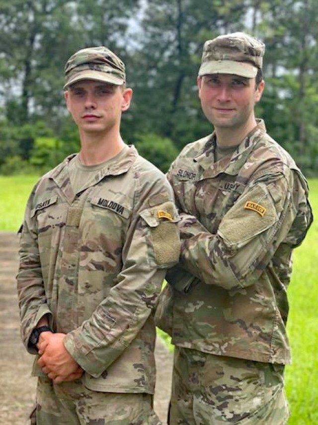 Maj. Andre Slonopas (right), commander of the Virginia National Guard&#39;s 134th Cyber Security Company, 124th Cyber Protection Battalion, 91st Cyber Brigade, proudly shows off his Ranger tab following the completion of the U.S. Army Ranger School in July 2021 at Fort Benning, Georgia. Slonopas, who began his career as an engineer officer with the Fredericksburg-based 116th Brigade Special Troops Battalion, switched to the Fairfax-based Data Processing Unit in 2014 and became one of the staff officers instrumental in standing up the 91st Cyber Brigade. (Courtesy)