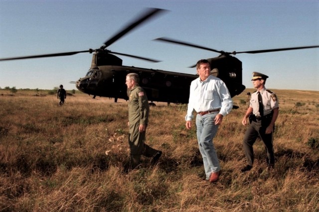 Left to right, Maj. Gen. William Lynch, Pennsylvania National Guard adjutant general; Pennsylvania Gov. Tom Ridge; and Pennsylvania State Police Commissioner Paul Evanko leave a CH-47 Chinook helicopter from the Pennsylvania National Guard&#39;s Company G, 104th Aviation Regiment, at the Flight 93 crash site in Somerset County, Pennsylvania, Sept. 11, 2001. (Photo by Terry Way/Commonwealth Media Services)