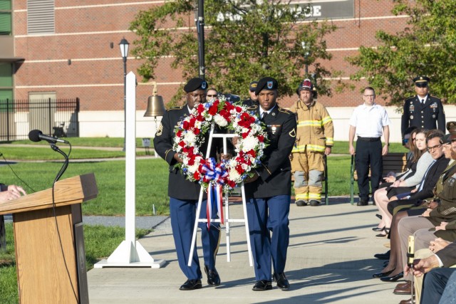 SFC Joseph Johnson and PFC Darrell Sykes carry the wreath in honor of those who died on 9/11 and the Global War on Terror at the 20th anniversary commemoration ceremony at the Army Heritage and Education Center, Sept. 11, 2021, Carlisle Pa.