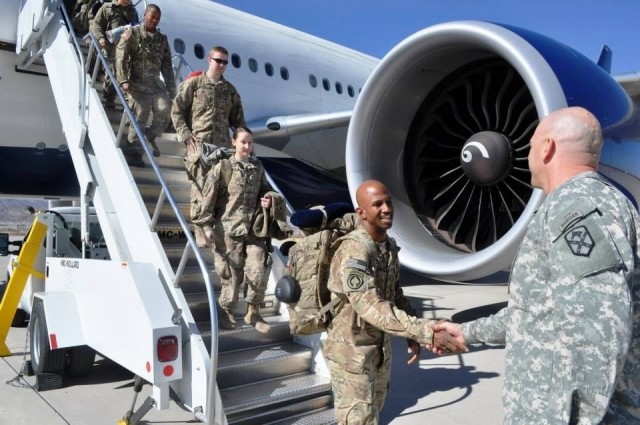 U.S. Army Command Sgt. Maj. Aarion Franklin, Maryland National Guard, is greeted after returning from deployment to Afghanistan Jan. 28, 2014, at Fort Bliss, El Paso, Texas. Franklin was among the many MDNG members who responded to the attacks on Sep. 11, 2001. (courtesy photo)