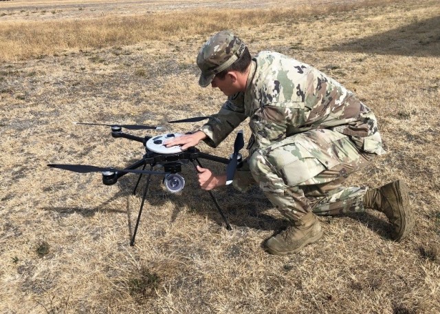Sgt. Traice R. Prentice, a U.S. Army Explosive Ordnance Disposal technician from the 707th Ordnance Company (EOD), prepares a Skyraider Unmanned Aerial System during field testing on Joint Base Lewis-McChord, Washington.  The company was one of the first EOD companies to field the UAS system.  U.S. Army photo by Sgt. 1st Class Jeremy M. Walsh.