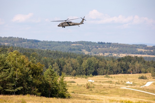 A UH-60M Black Hawk helicopter, operated by Soldiers assigned to the 12th Combat Aviation Brigade, conducts an aerial firing exercise on Grafenwoehr Training Area, Germany, Sep. 14, 2021. Soldiers assigned to 12th CAB are currently training for an event called Royal Black Hawk where they will train alongside the French military in October.