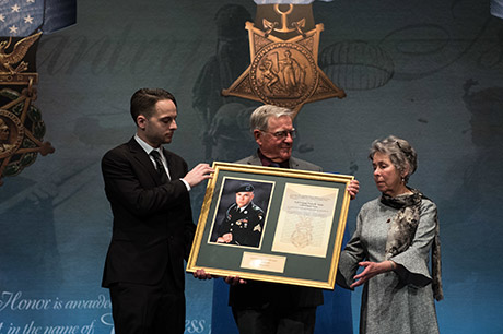 Mr. David L. Norquist, performing the duties of the U.S. deputy secretary of defense, posthumously inducts U.S. Army Staff Sgt. Travis Atkins into the Pentagon's Hall of Heroes during a ceremony with the Atkins' family at the Pentagon in Washington, D.C., March 28, 2019. The induction will add Atkins' name to the in the Hall of Heroes, the Department of Defense's permanent display of record for all recipients of the Medal of Honor. (DOD photo by U.S. Army Sgt. Amber I. Smith)
