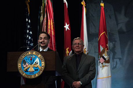 U.S. Army Sgt. Travis Atkins’ son, Trevor Oliver and father Jake Atkins, speak during Atkins’ posthumous induction into the Hall of Heroes in a ceremony hosted by Mr. David L. Norquist, performing the duties of the U.S. deputy secretary of defense, at the Pentagon, Washington, D.C., March 28, 2019. (DoD photo by U.S. Army Sgt. Amber I. Smith)