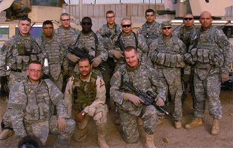Then-Sgt. Travis Atkins poses with battle buddies in Iraq, 2007. (Photo courtesy of the Atkins family)