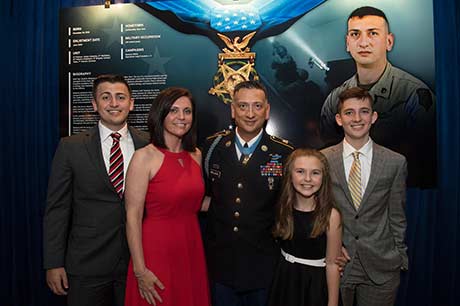 Staff Sgt. David G. Bellavia and his family attend a ceremony inducting him into the Pentagon Hall of Heroes, in Arlington, Va., June 26, 2019, for actions while serving as a squad leader with the 1st Infantry Division in support of Operation Phantom Fury in Fallujah, Iraq. (U.S. Army Photo by Sgt. Kevin Roy)