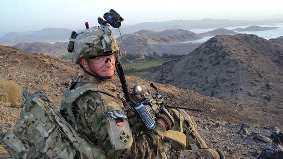 Staff Sgt. Ty Carter provides overwatch on a road near Dahla Dam, Afghanistan, July 2012.
