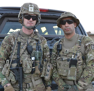 U.S. Army Sgt. Andrew Mahoney (left) of Laingsburg, Mich., with then-1st Lt. Florent Groberg serving on a personal security detail with the 4th Infantry Brigade Combat Team, 4th Infantry Division, during a deployment to Regional Command-East, Afghanistan. (Photo courtesy of Retired U.S. Army Capt. Florent Groberg)