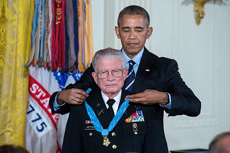 President Barack Obama presents the Medal of Honor to retired U.S. Army Lt. Col. Charles Kettles for conspicuous gallantry, in the East Room of the White House, July 18, 2016. Then-Maj. Kettles distinguished himself in combat operations near Duc Pho, Republic of Vietnam, on May 15, 1967 and is credited with saving the lives of 40 Soldiers and four of his own crew members. White House photo by Chuck Kennedy