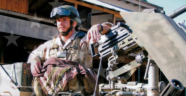 Robert J. Miller with a mounted grenade launcher