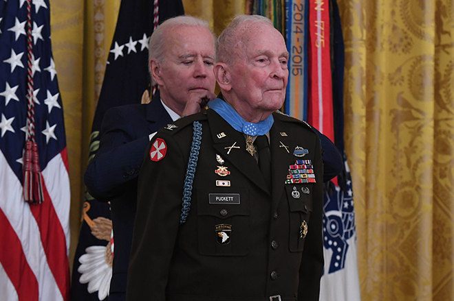 President Joseph Biden presents the Medal of Honor to retired Col. Ralph Puckett Jr. during a ceremony at the White House in Washington, D.C., May 21, 2021. Puckett was awarded the Medal of Honor for his heroic actions while serving then as commander of the Eighth Army Ranger Company when his company of 57 Rangers was attacked by Chinese forces at Hill 205 near the Chongchon River, during the Korean Conflict on November 25-26, 1950. (Spc. XaViera Masline)