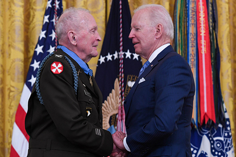President Joseph Biden presents the Medal of Honor to retired Col. Ralph Puckett Jr. during a ceremony at the White House in Washington, D.C., May 21, 2021. Puckett was awarded the Medal of Honor for his heroic actions while serving then as commander of the Eighth Army Ranger Company when his company of 57 Rangers was attacked by Chinese forces at Hill 205 near the Chongchon River, during the Korean Conflict on November 25-26, 1950. (Spc. XaViera Masline)