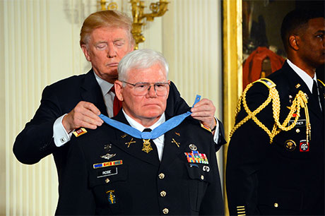 President Donald Trump places the Medal of Honor around the neck of Capt. Mike Rose, during an Oct. 23, 2017 ceremony at the White House, in Washington, D.C. U.S. Army photo by C. Todd Lopez